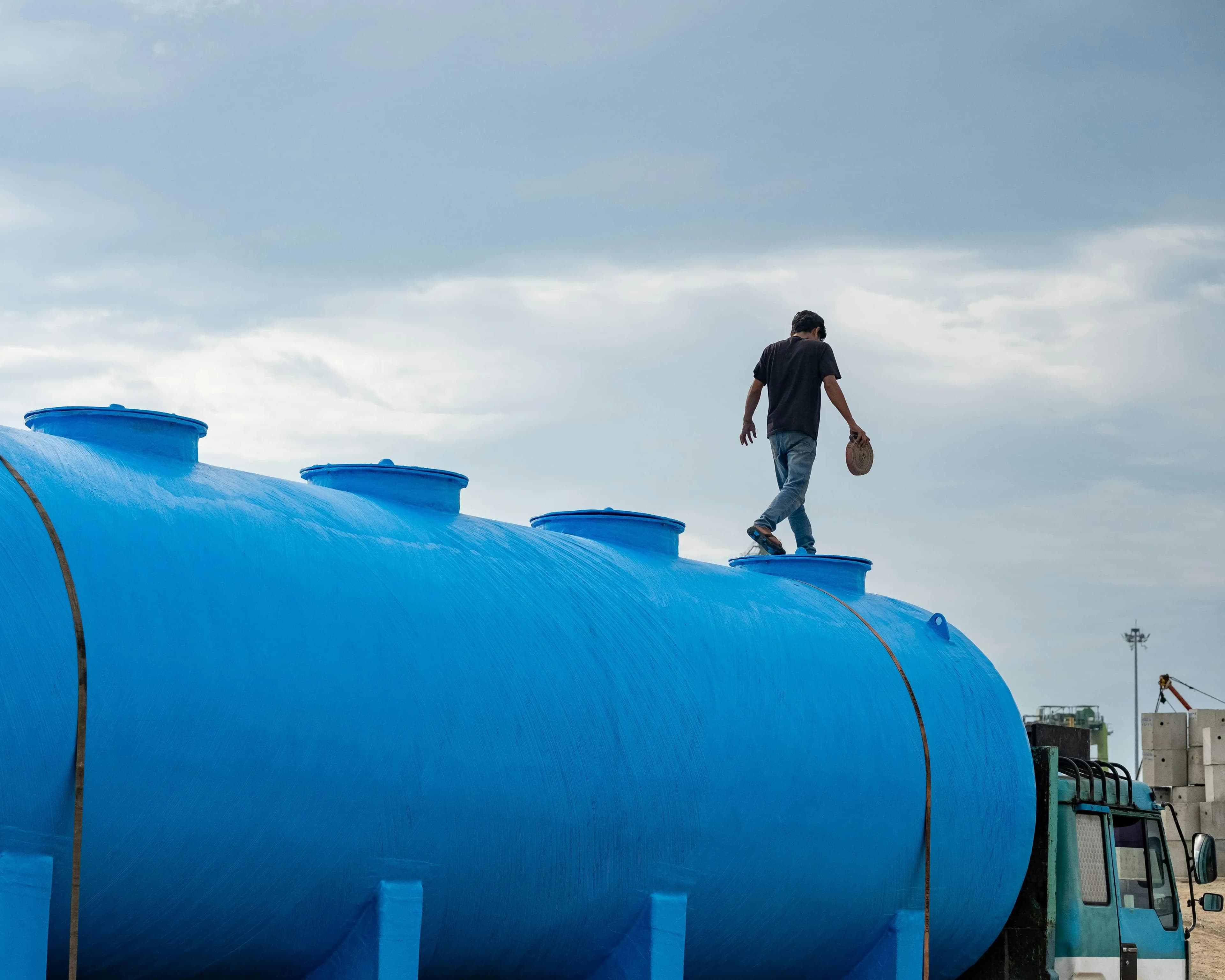 Man on Blue Cylinder